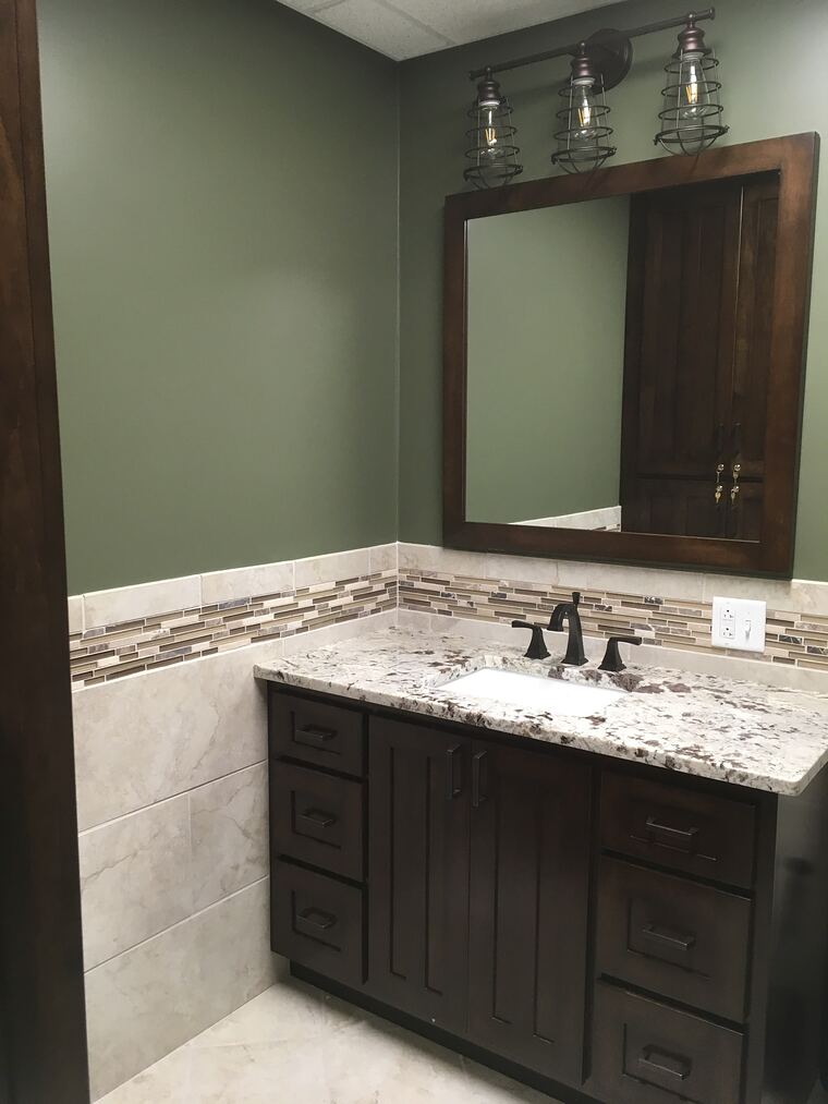 Bathroom vanity with granite and mosaic tile