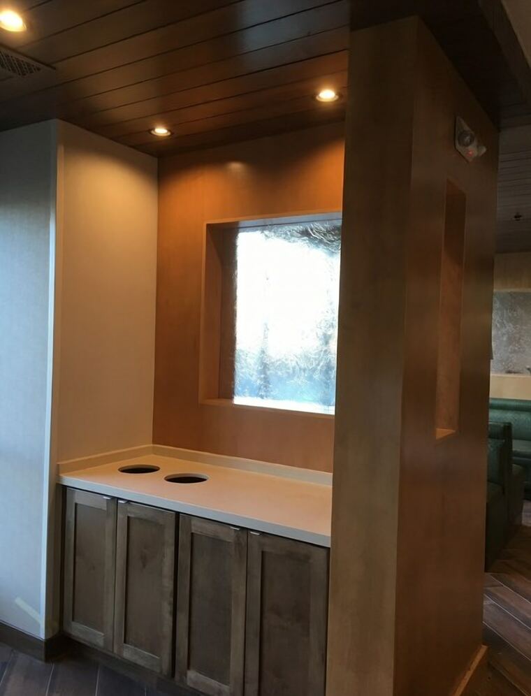 Bus station with stained base cabinets and a quartz top