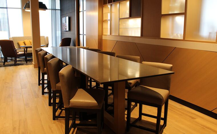 Communal table with lit display niches