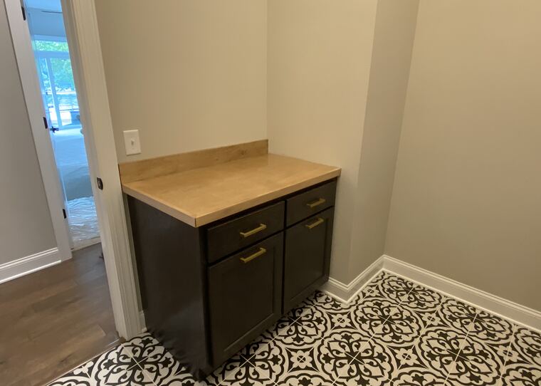 Custom base cabinet on patterned tile floor