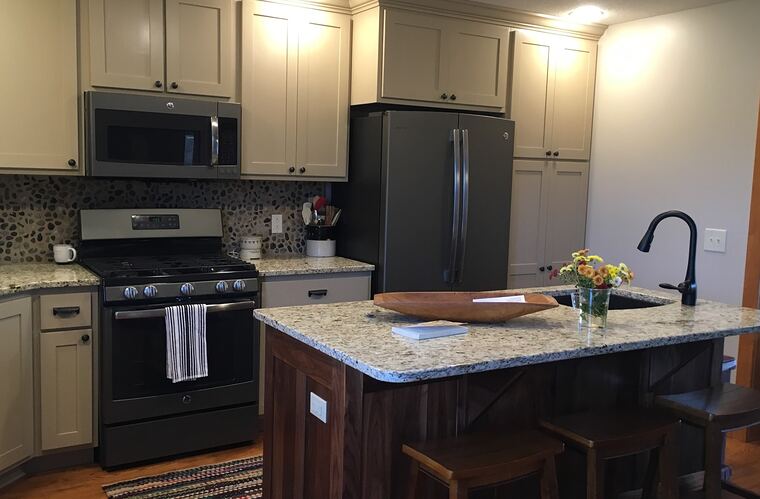 Custom kitchen with a walnut island