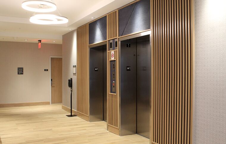 Elevator lobby with wood slat walls