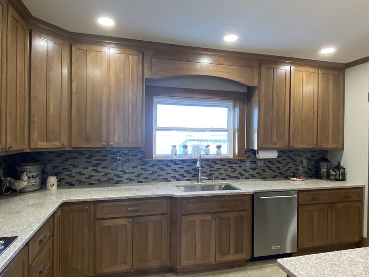 Maple kitchen with an arched valance above the sink
