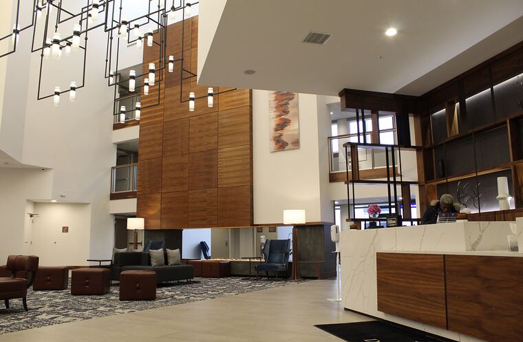 Hotel lobby with reception and display wall