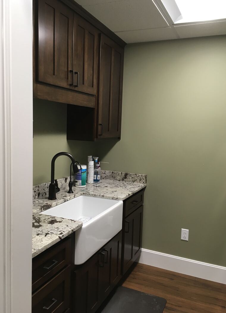 Kitchen with dark cabinets and farmhouse sink
