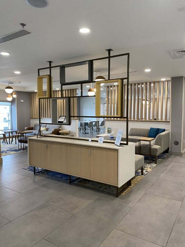 Market island with a black grid partition and gold panels