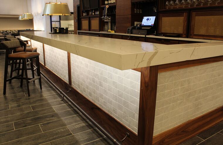Walnut and quartz waterfall bar